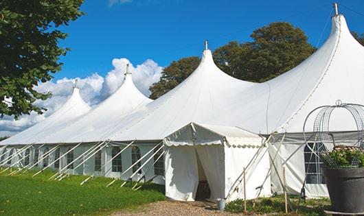 a line of portable restrooms in a shaded area, offering a comfortable experience for users in Sunrise